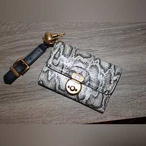 Steve Madden wallet with wrist strap.